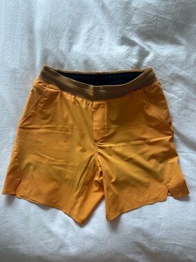 Ten Thousand Men's Athletic Shorts in Yellow/Orange. 6.5” inseam. Lined.
